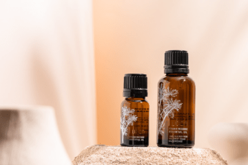 Close up shot of frankincense essential oils in 2 small different sizes of bottles